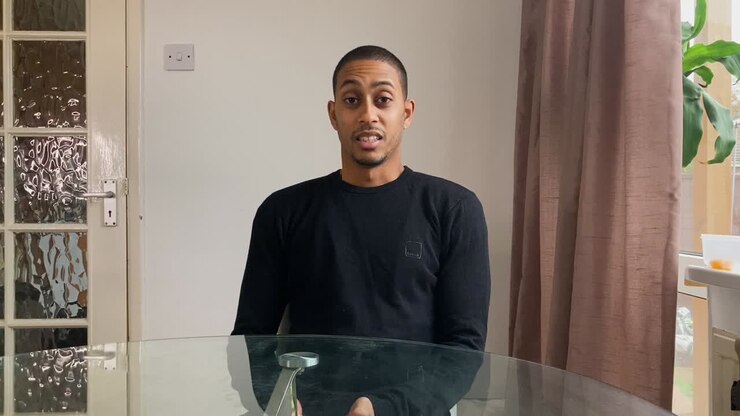 Young Man On a Video Call Looking Visibly Depressed As He Talks to Therapist