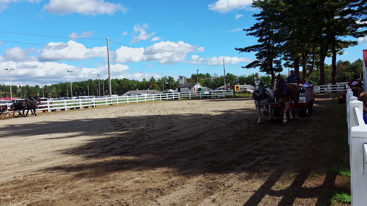 Ponies pulling cart of visitors to the Cumberland Fair near Portland, Maine