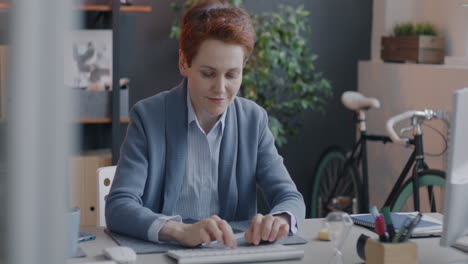 woman working at her computer in a modern office
