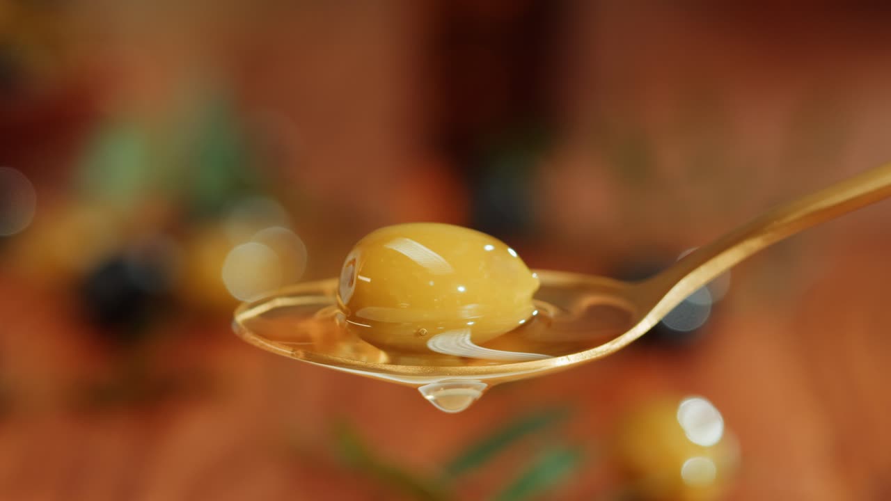 Golden Spoon with Olives and Olive Oil