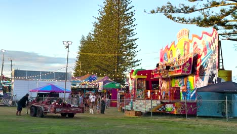 vibrant carnival scene with rides and people