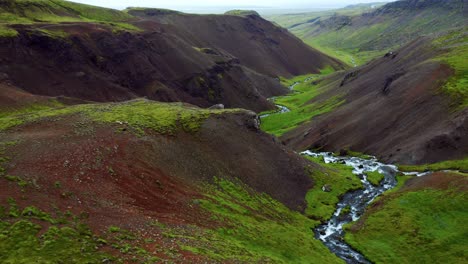 panoramic view of reykjadalur valley with flowing hot spring river in iceland