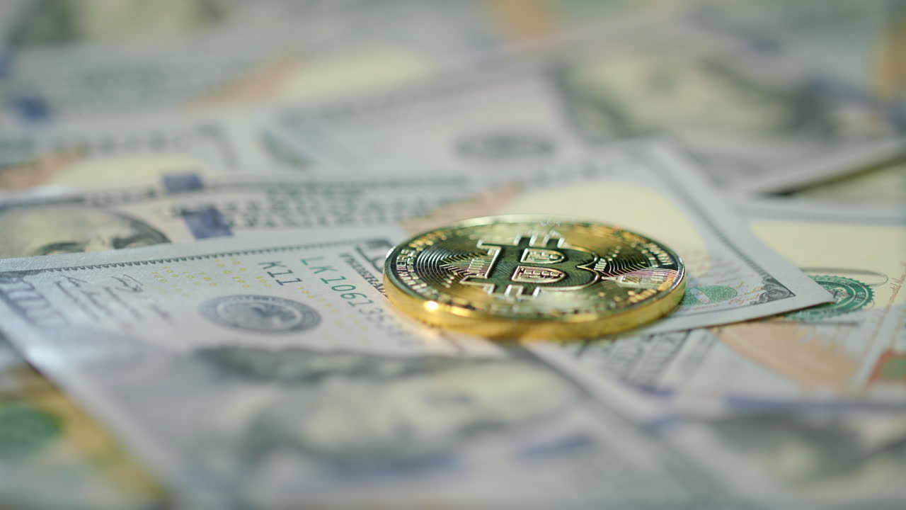 Cryptocurrency finance bitcoin business. Gold bit coin lie on dollar bills