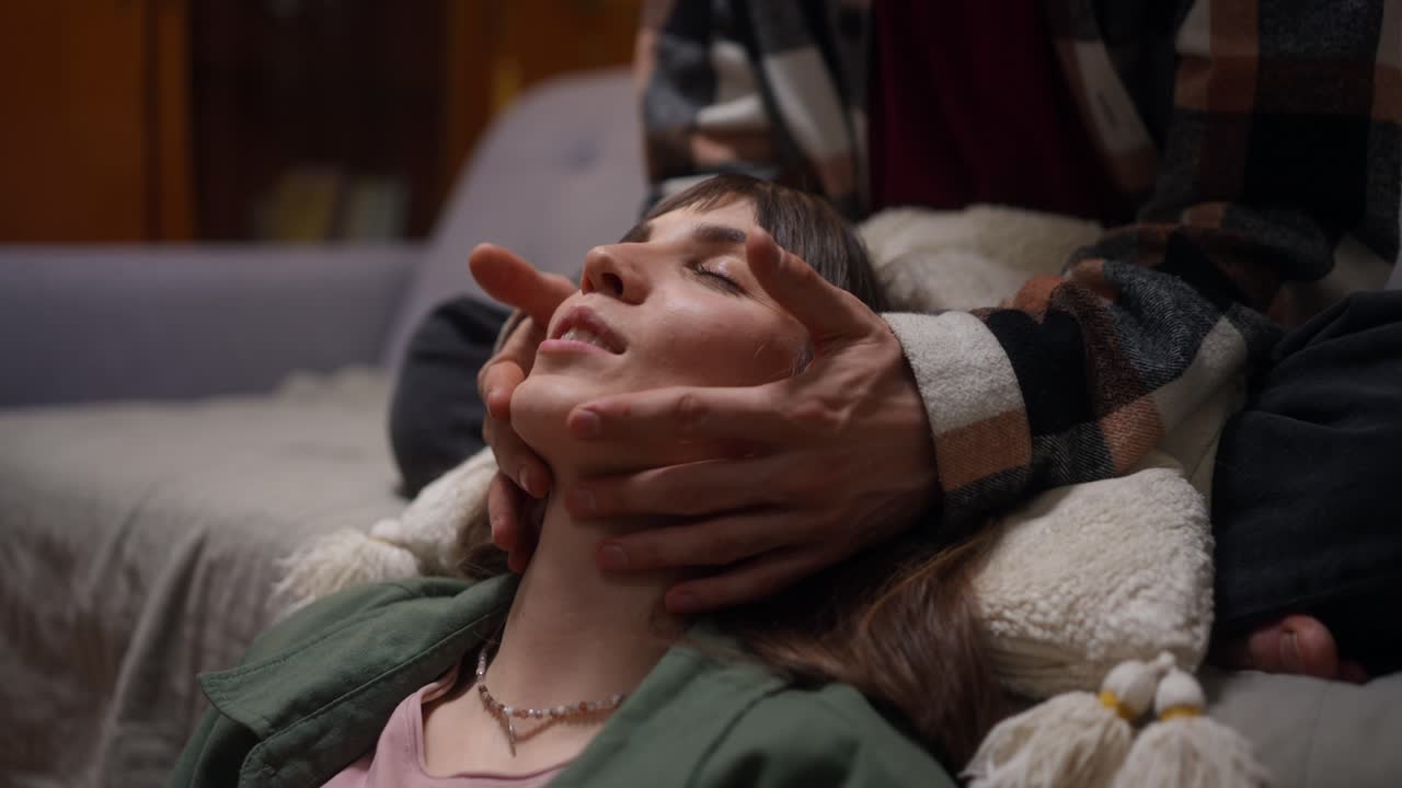 Woman receiving a relaxing face massage