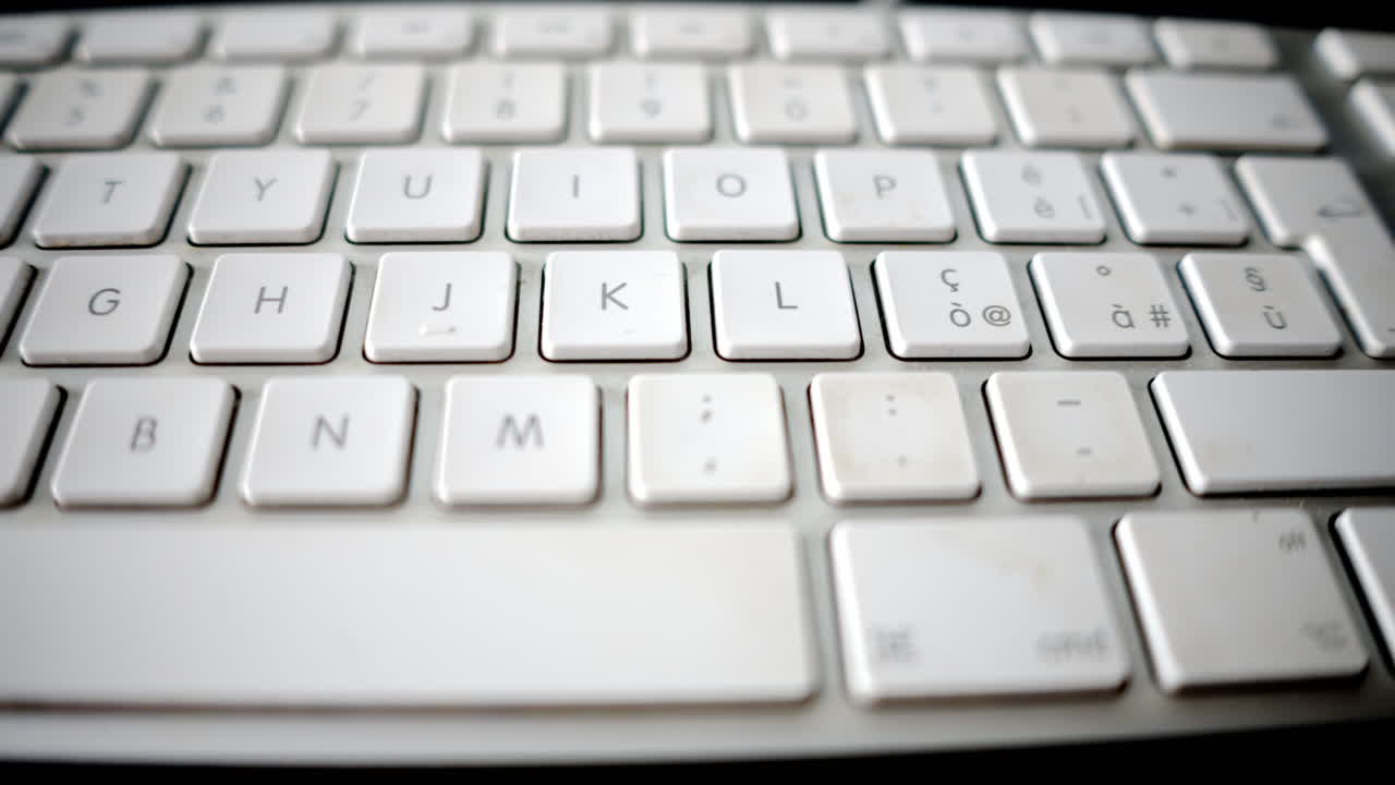White keyboard close up slow motion