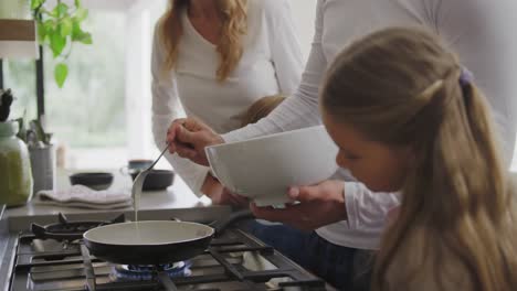 Family-preparing-food-in-kitchen-at-home-4k