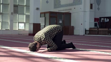 man worships in mosque