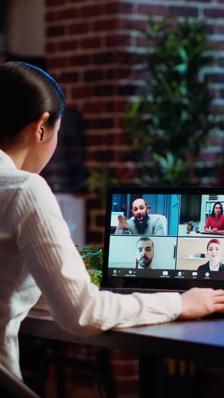 Vertical video Staff member discussing with members of board of directors during videocall