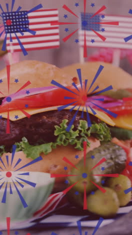 animation of fireworks over burgers with usa flags