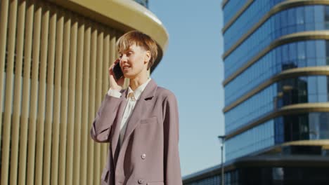 businesswoman on phone in city