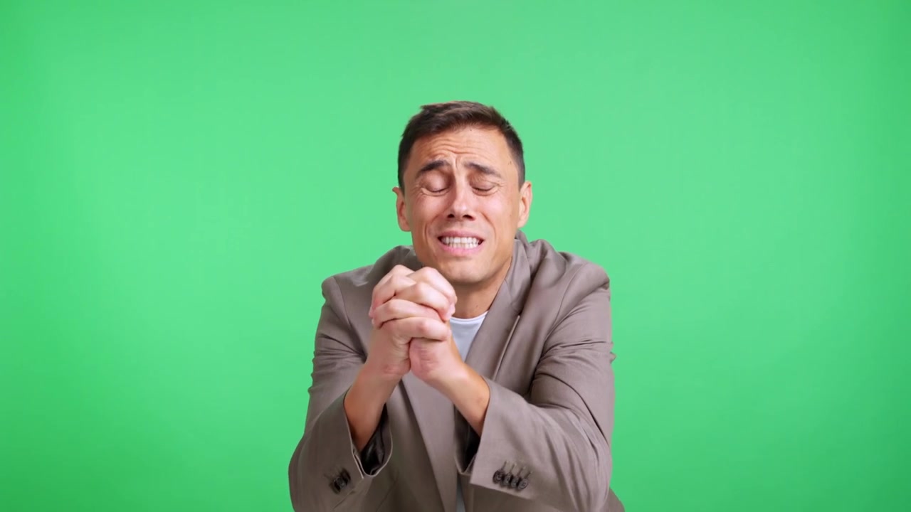 Desperate man pleading and begging on green screen background