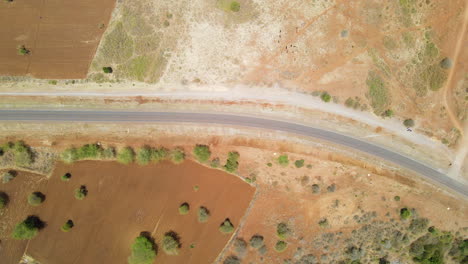 Top-down-aerial-of-empty-road-in-rural-Kenya