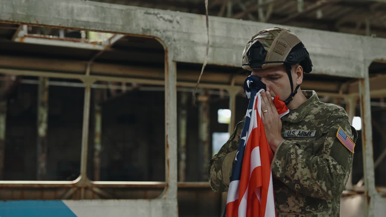 Soldier Mourns with American Flag