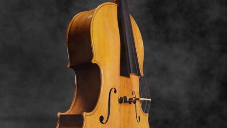 cello upright with reflection and beautiful wood, smoke background