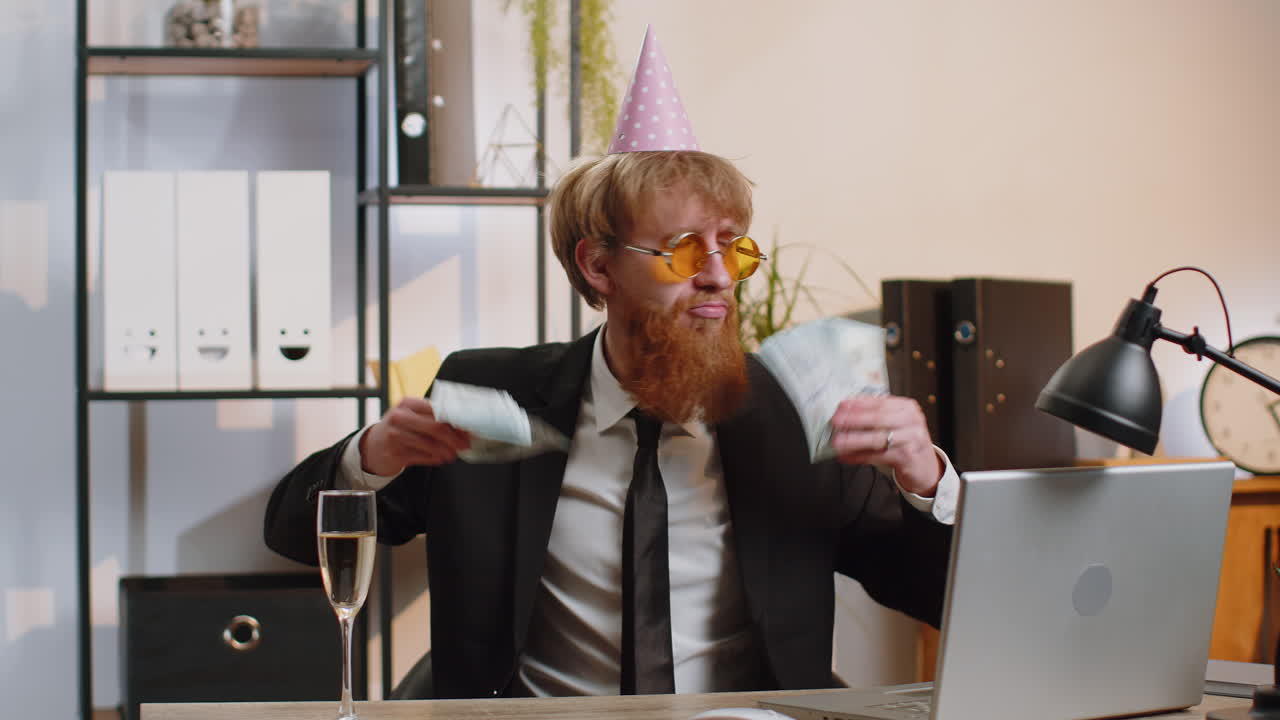 Rich business man at office waving money dollar cash career lottery winner big income wealth