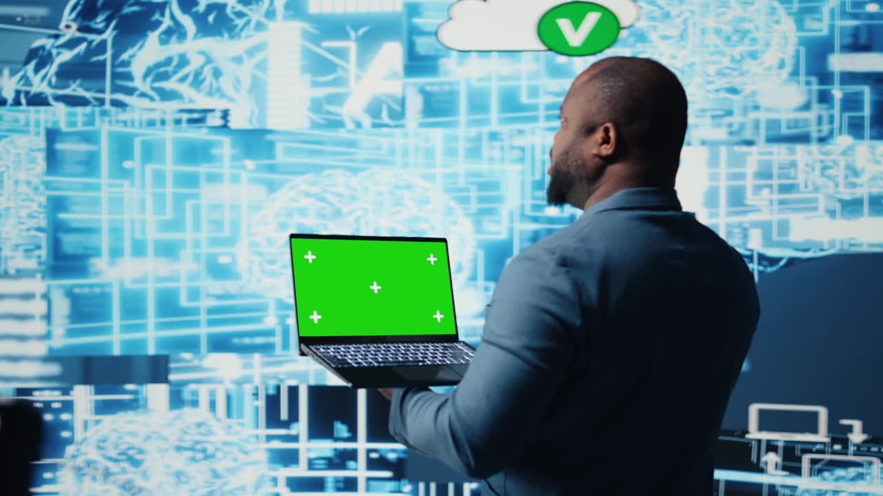 Young entrepreneur technician using advanced technology and green screen