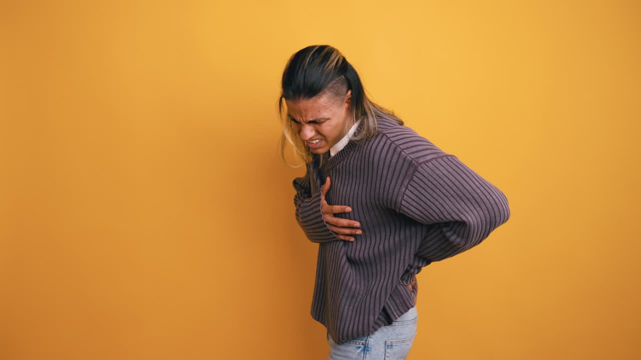 Young Person Suffering from Back and Chest Pain