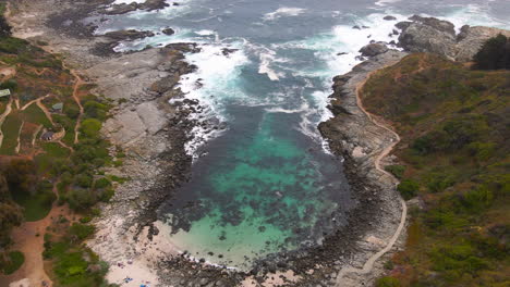 aerial - beautiful rocky bay in zapallar, valparaiso, chile, wide static shot