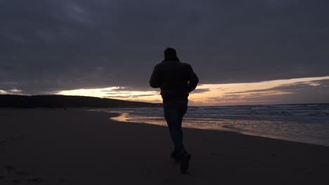 man running beach