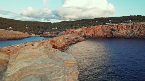 punta de sa galera - picturesque cove of rocks and stones on the coast of ibiza in spain