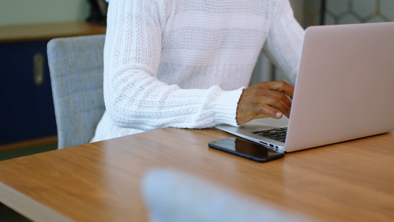Senior man using laptop in office 4k