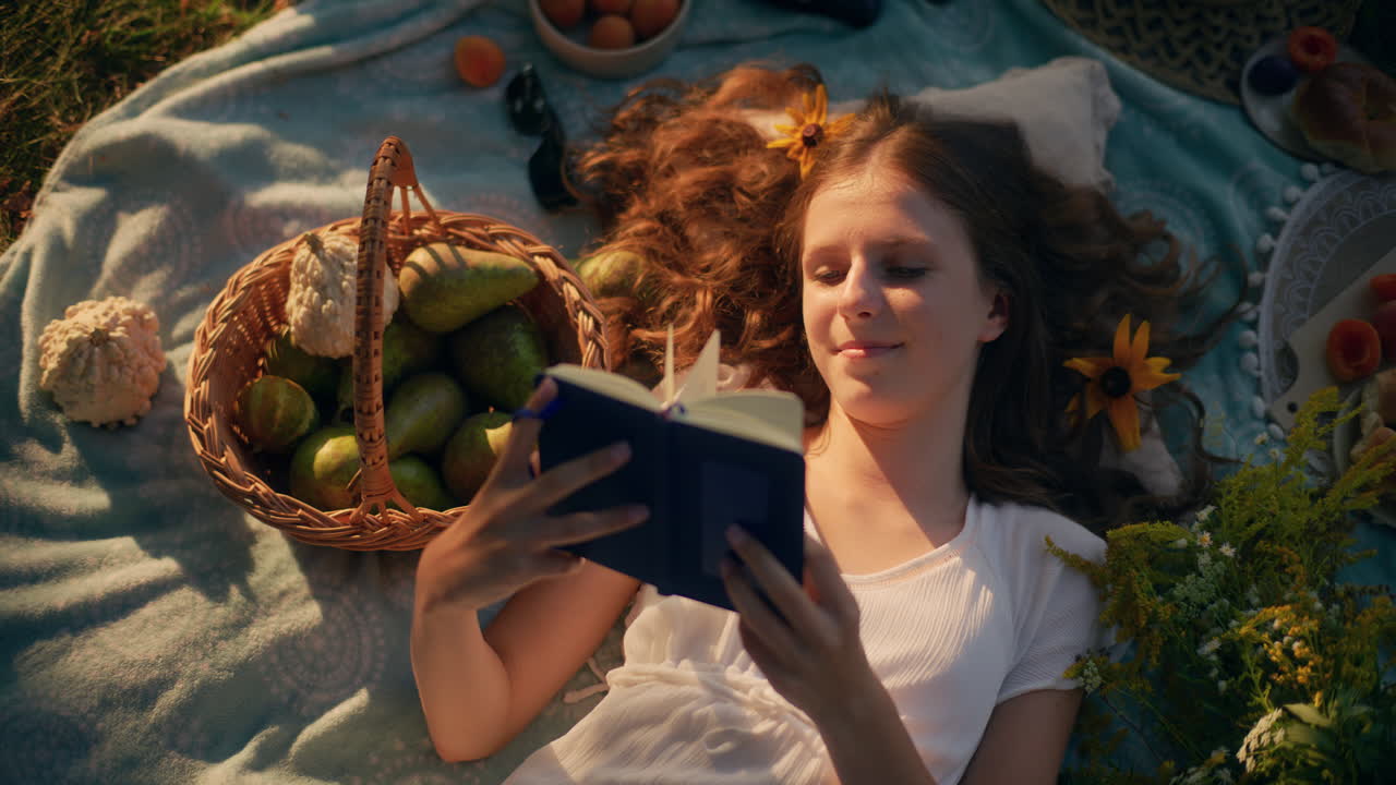 Child lying on grass in summer trance