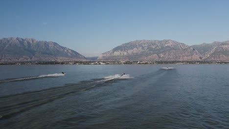 jet ski waverunners on utah lake with beautiful mountain scenery, aerial