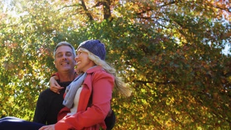 man spinning wife around outdoors