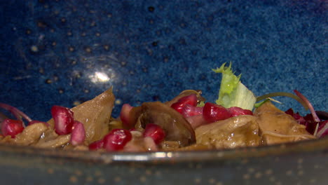 appetizer with liver, mushrooms, and pomegranate