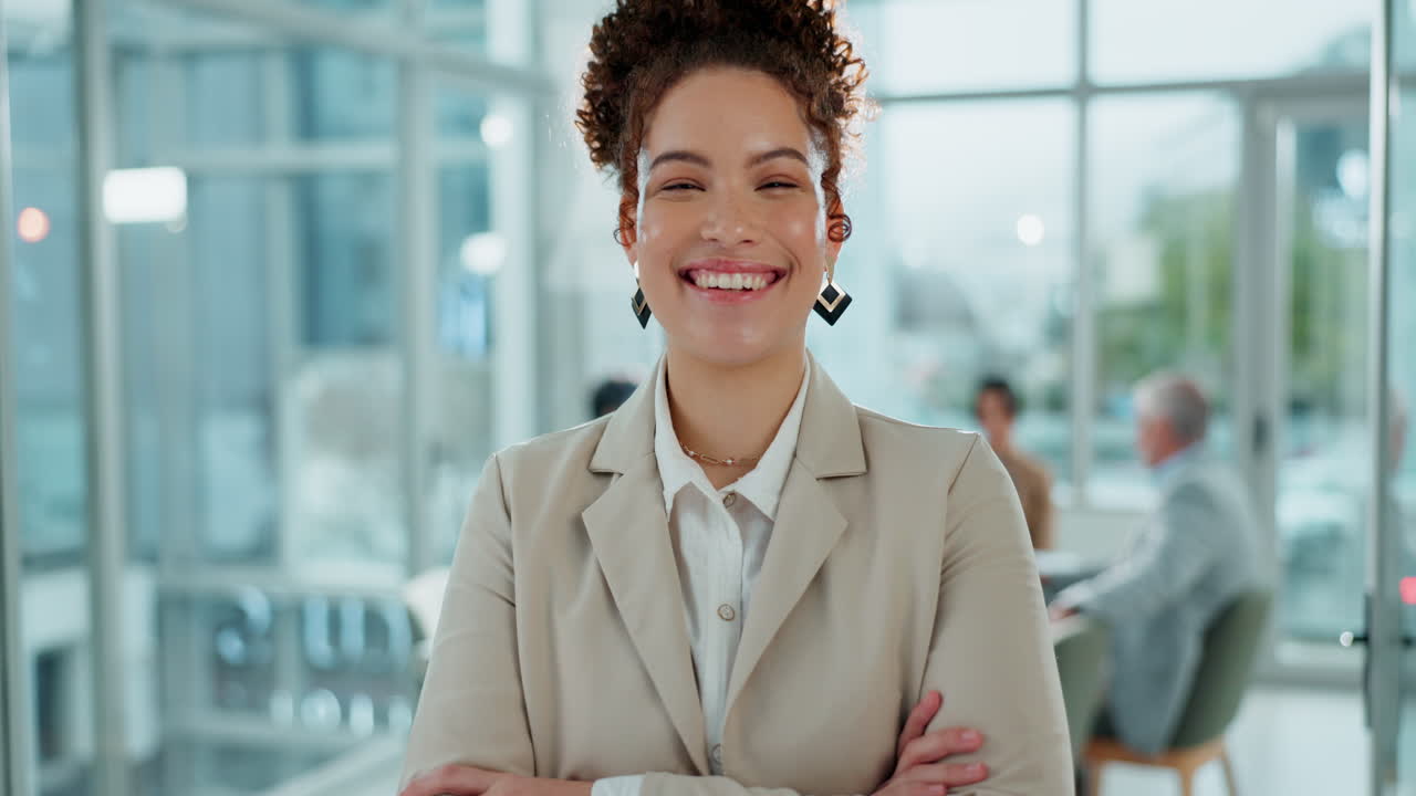A confident businesswoman smiling in a modern office