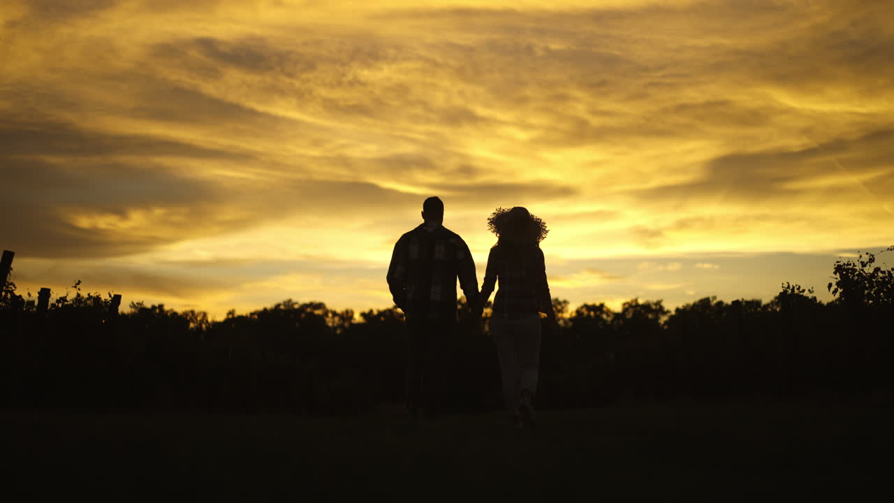 Couple enjoying a romantic sunset walk