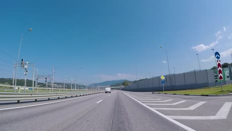 highway driving scene on a sunny day