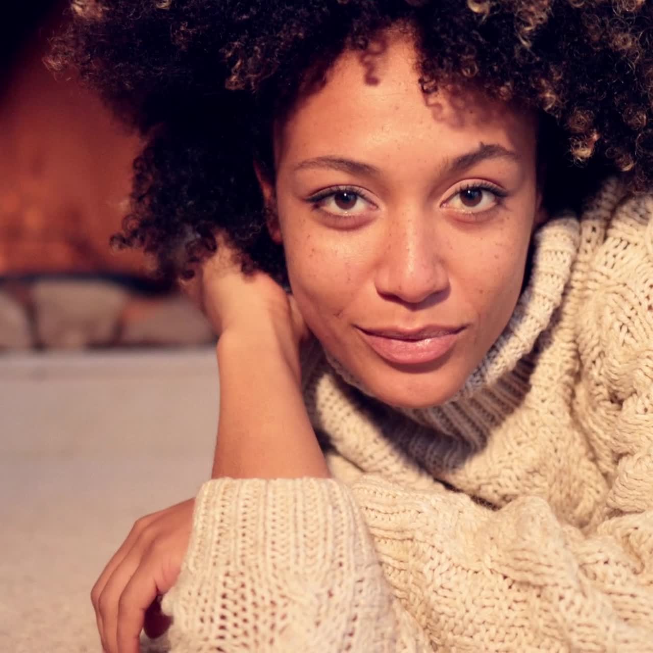 Close up of pretty black woman in sweater