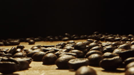 coffee-beans-falling-from-above-on-a-wooden-surface