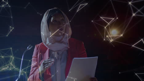 una red de conexiones contra una mujer con hijab que lee un documento