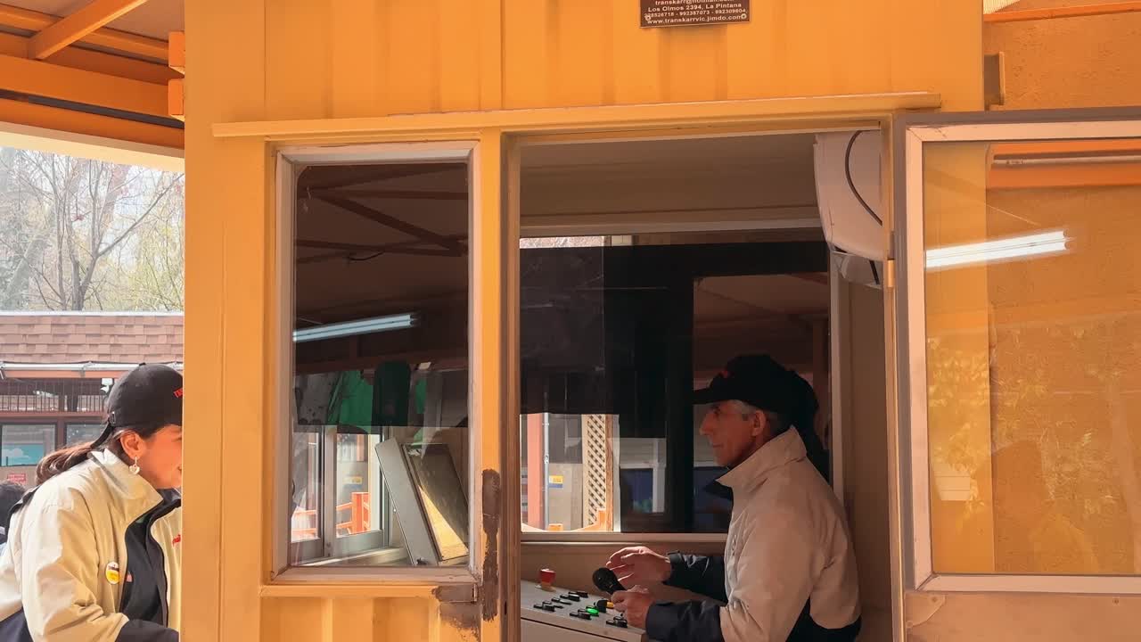 Amusement park machinery operator in Santiago de Chile, Fantasilandia. Sunny day, entertainment