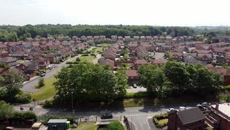 aerial view across new red brick housing estate with community gardens real estate property in england
