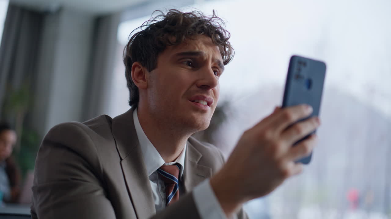 Hand taking mobile phone notification reacting bad message at agency closeup