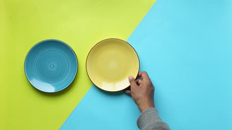 blue and yellow plates on a green and blue background