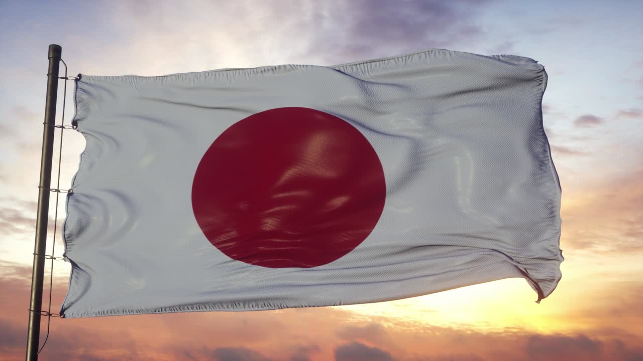 bandera de japón ondeando en el viento contra el cielo profundo hermoso al atardecer