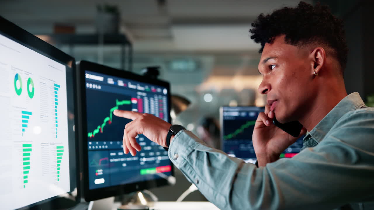 Businessman on Phone Call in Stock Market Office