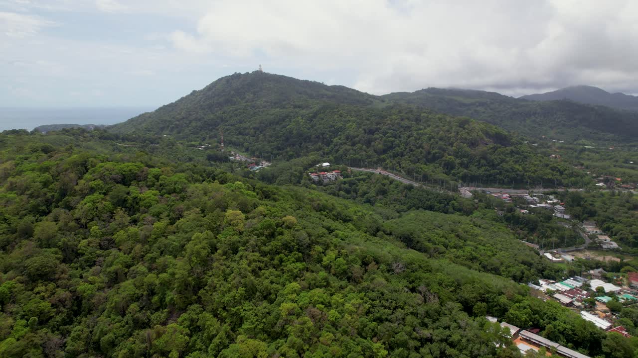 Thailand Phuket, aerial drone shot over a Rawai Mueang district on a beautiful sunny day, a turquoise lagoon facing Phi Phi island