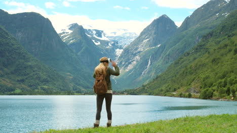 woman experiencing virtual reality in a scenic norwegian fjord