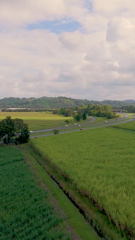 vehicles travel through scenic countryside landscape
