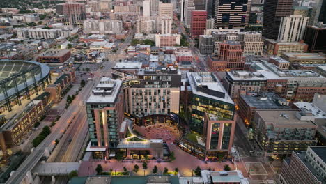 Pull-Back-Drone-Shot-Of-Downtown-Denver-and-McGregor-Square-at-Dusk