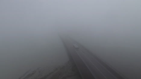 really foggy day road going to mont saint michel aerial drone view france