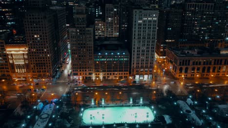 mccormick tribune ice rink night winter chicago aerial timelapse paning left and right showing n milwaukee ave traffic