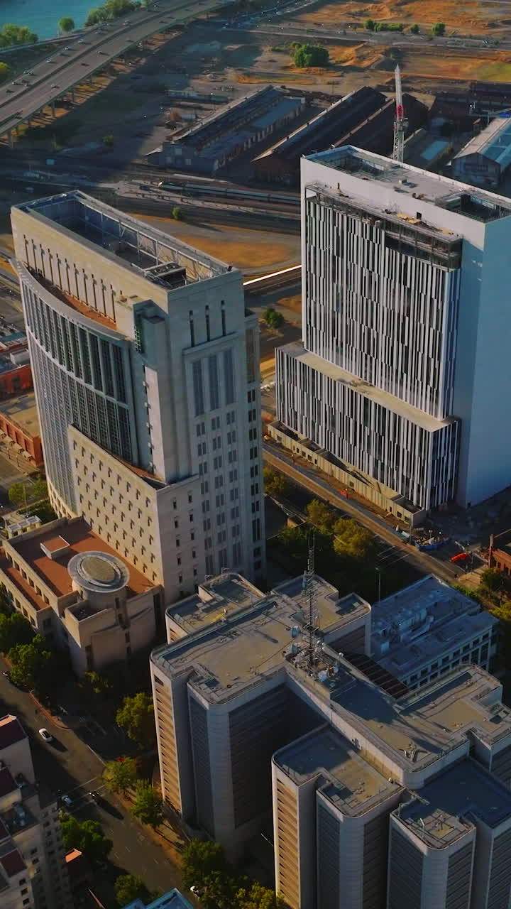 Contemporary architecture of Sacramento downtown. Sunny scenery of the city with lively traffic on sunny daytime. Vertical video