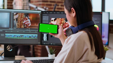 Asian-female-editor-working-from-home-for-freelance-work-with-green-screen