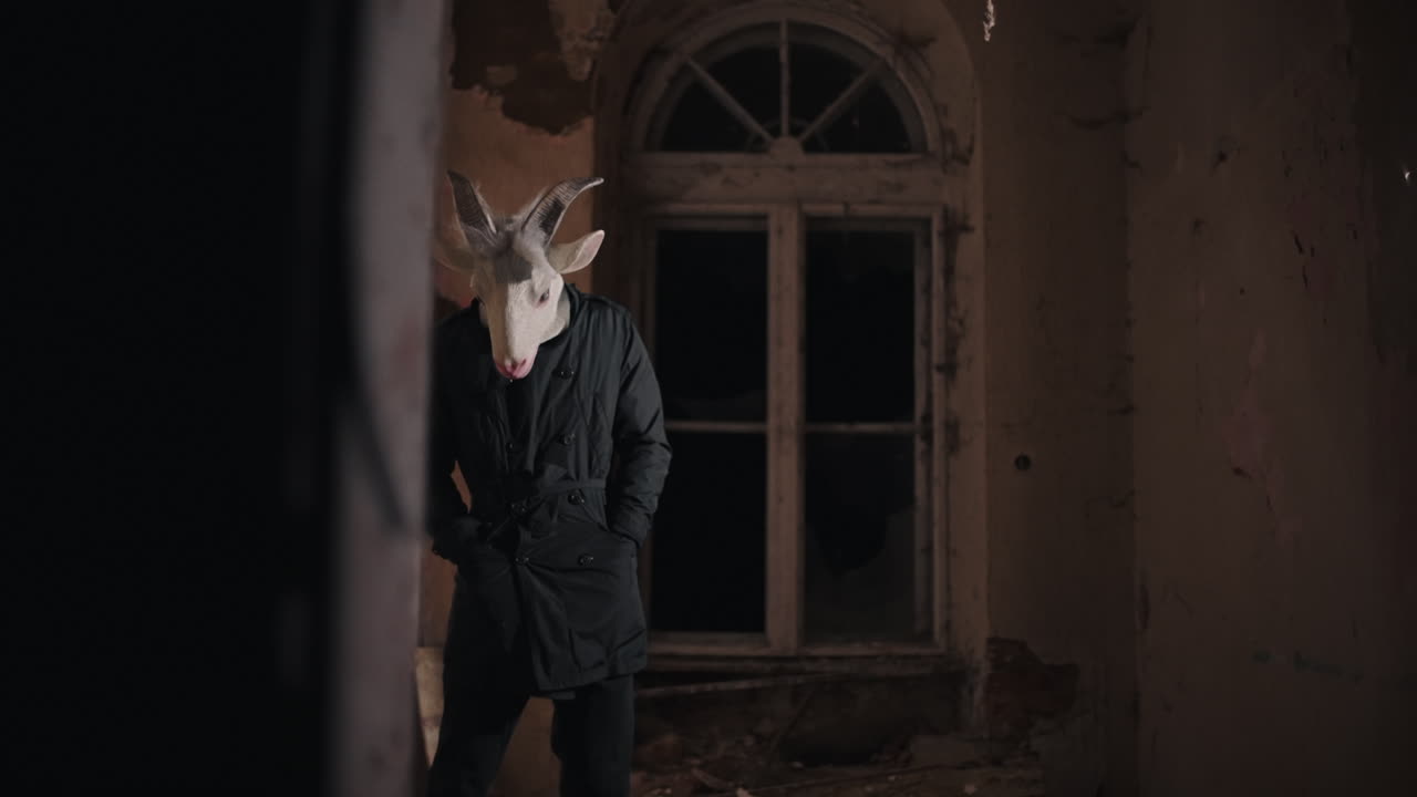 Man in Goat Mask in Abandoned Building